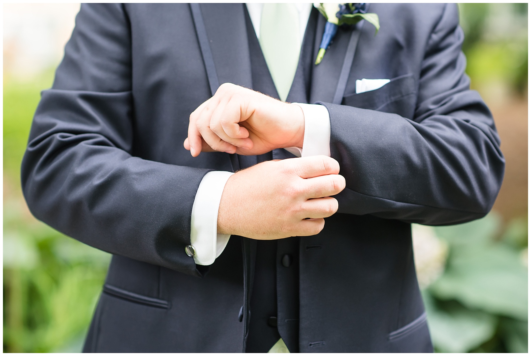Groom adjusting cuff link in 2018 wedding photography favorites