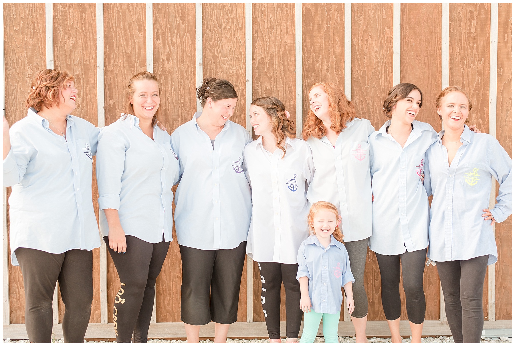 Bride and bridesmaids laughing in matching wedding shirts in 2018 wedding photography favorites