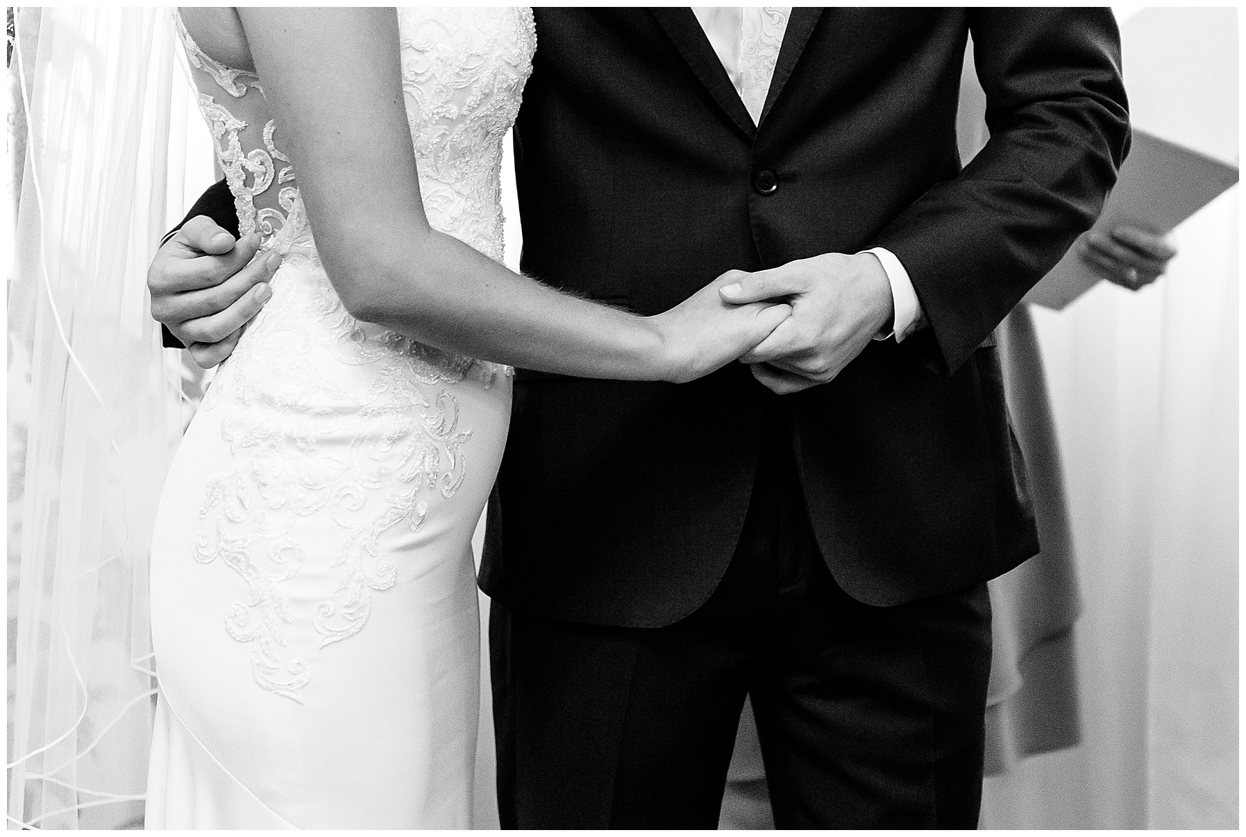Black and white photo for bride and groom holding hands in my wedding photography favorites