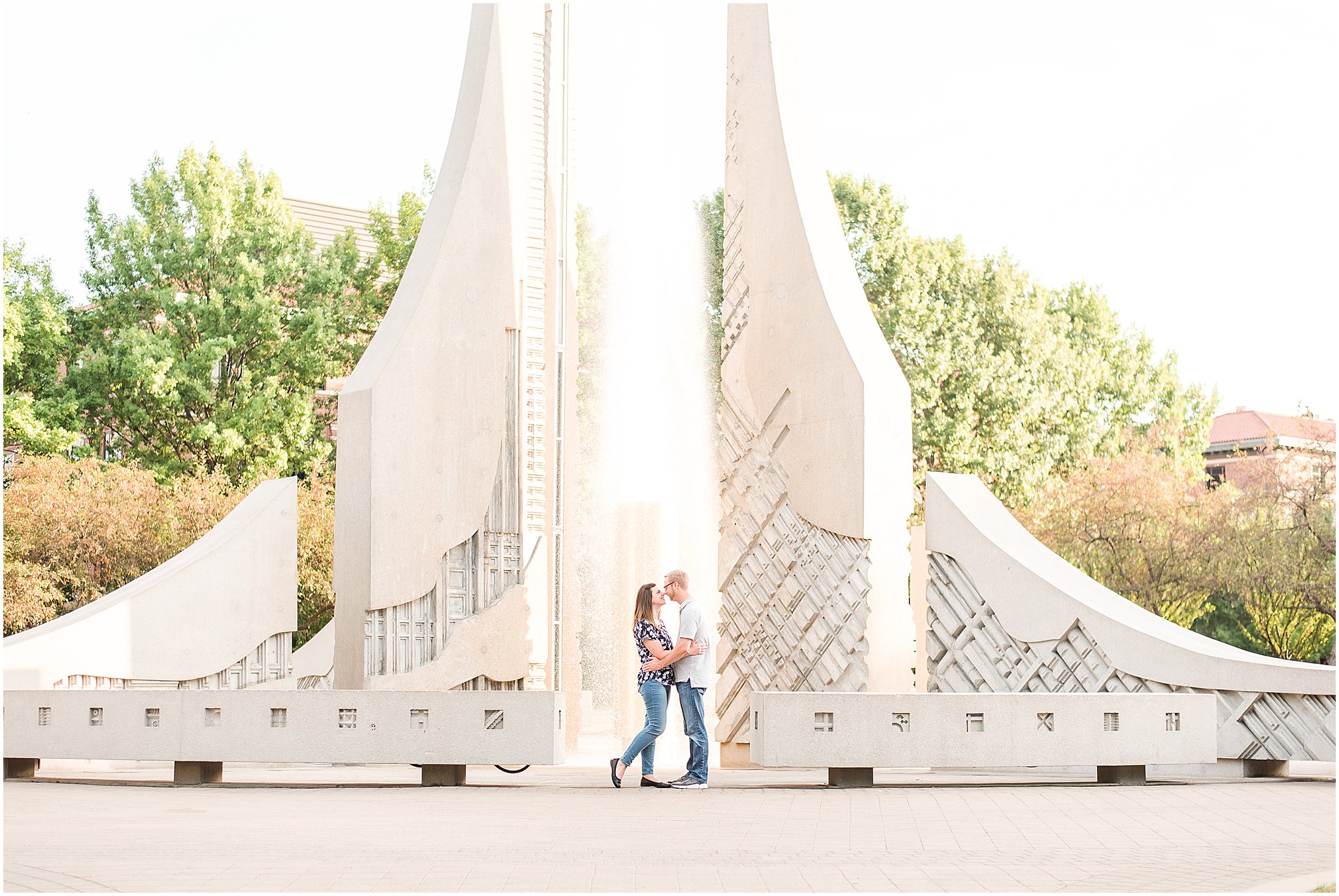 Couple nose to nose in front of engineering fountain at Purdue University