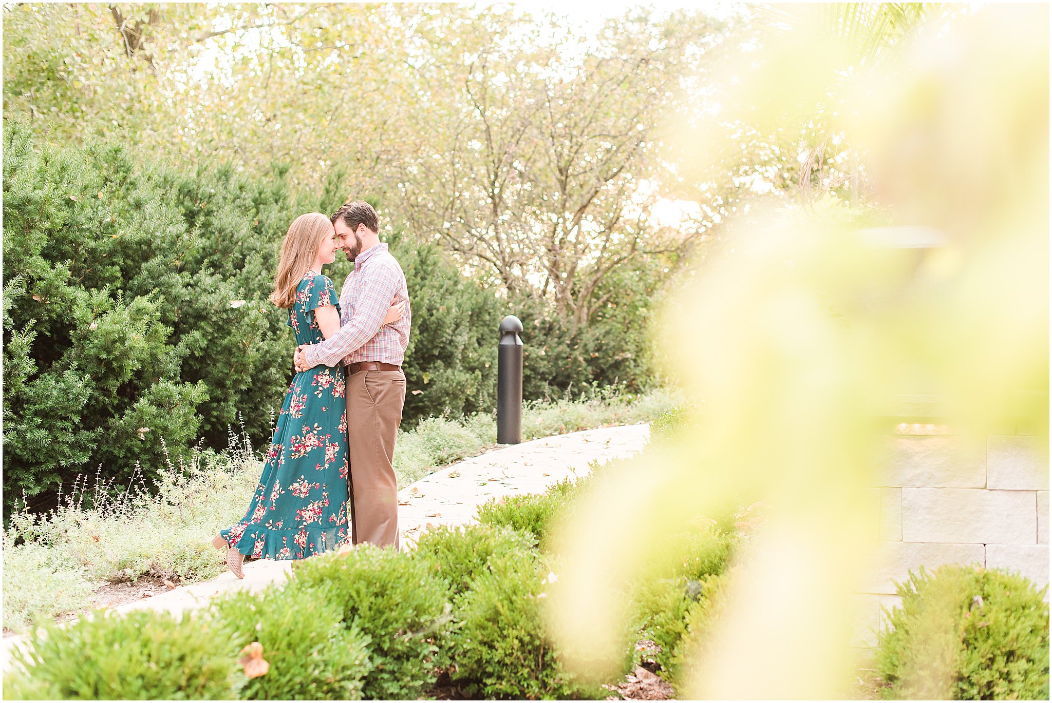 Bride and groom nose to nose during Coxhall Gardens engagement session