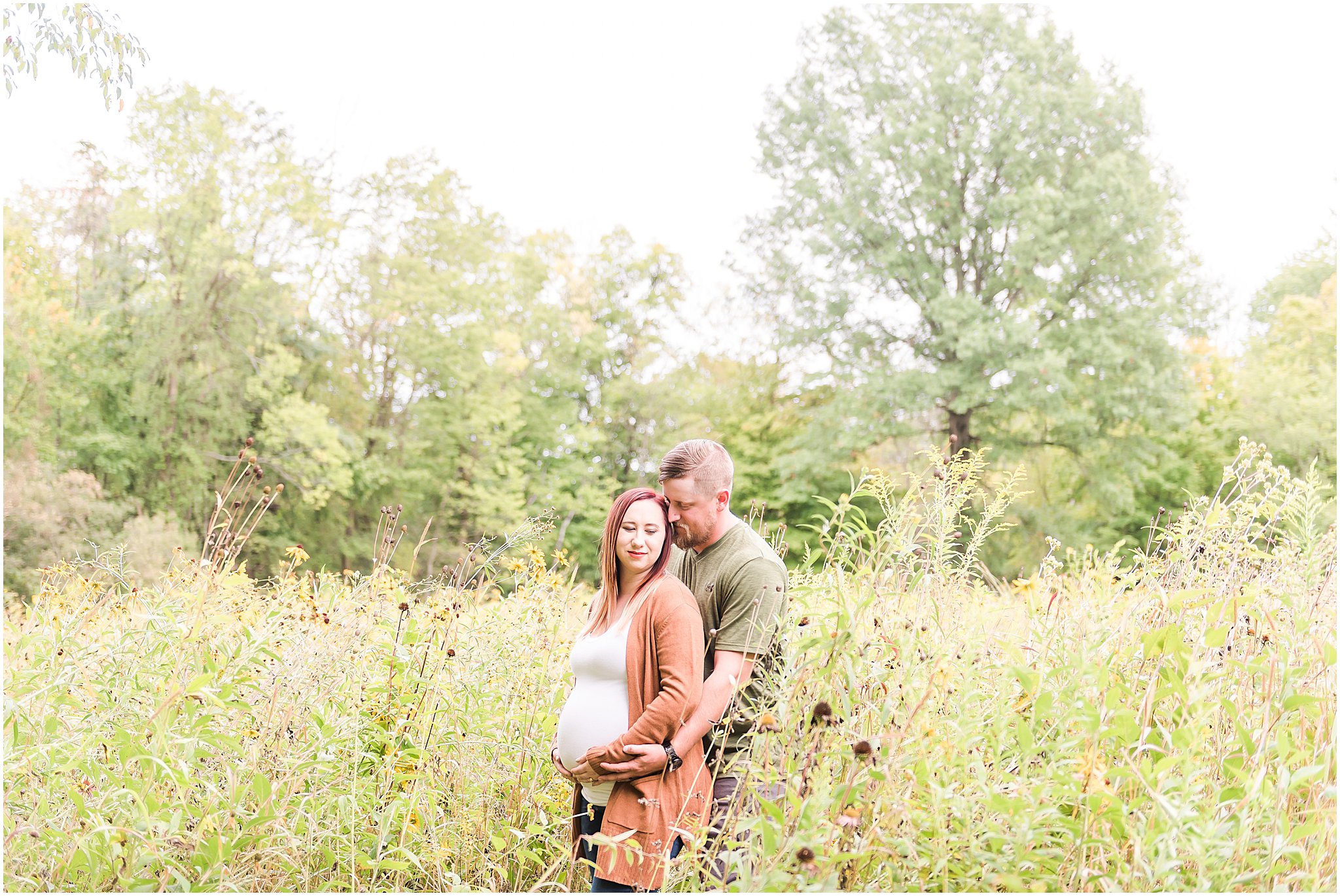 Pregnant woman softly looking over shoulder during Eagle Creek Park maternity session