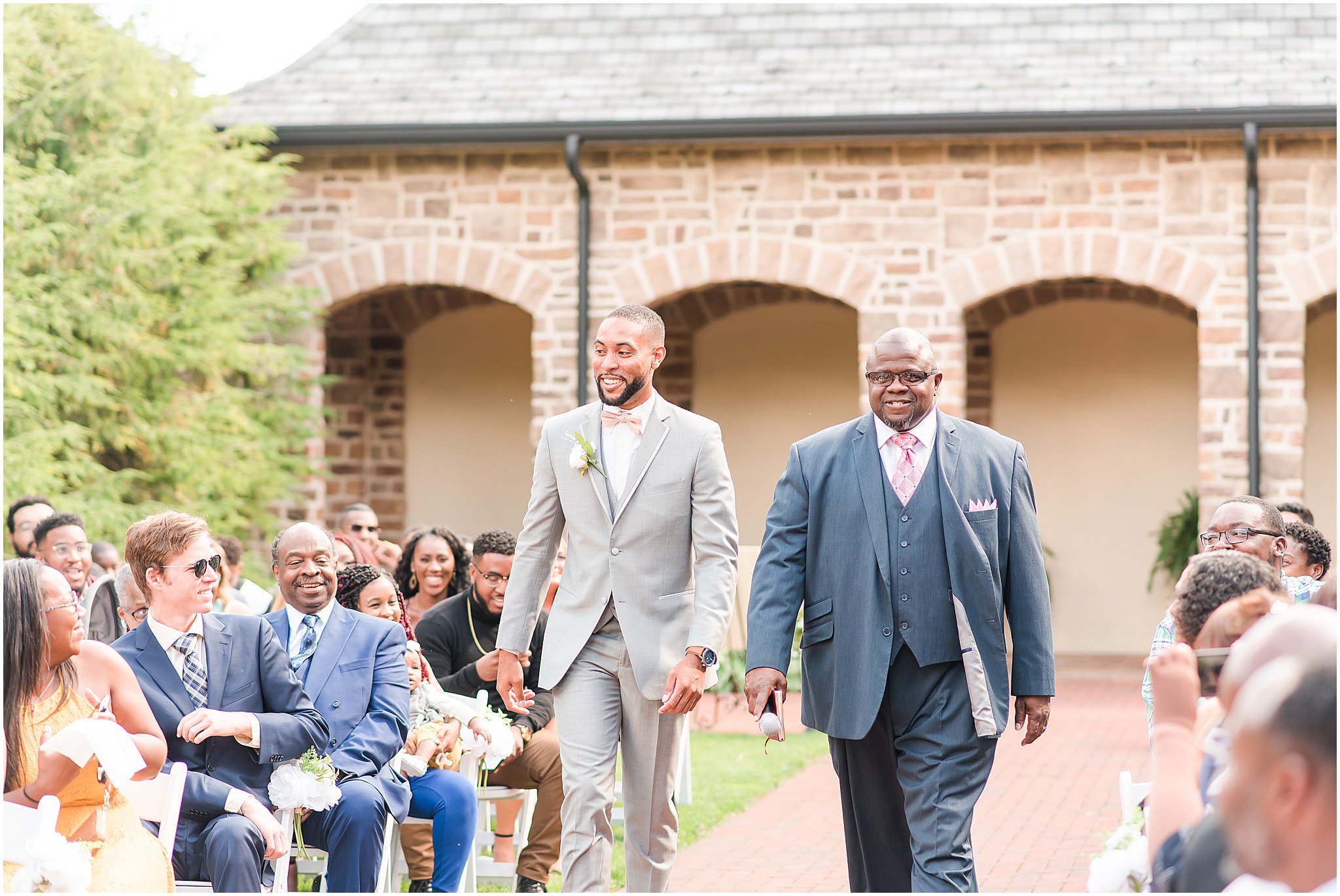 Groom walking down the aisle during outdoor ceremony at Pinnacle Golf Club | Courtney Carney Photography