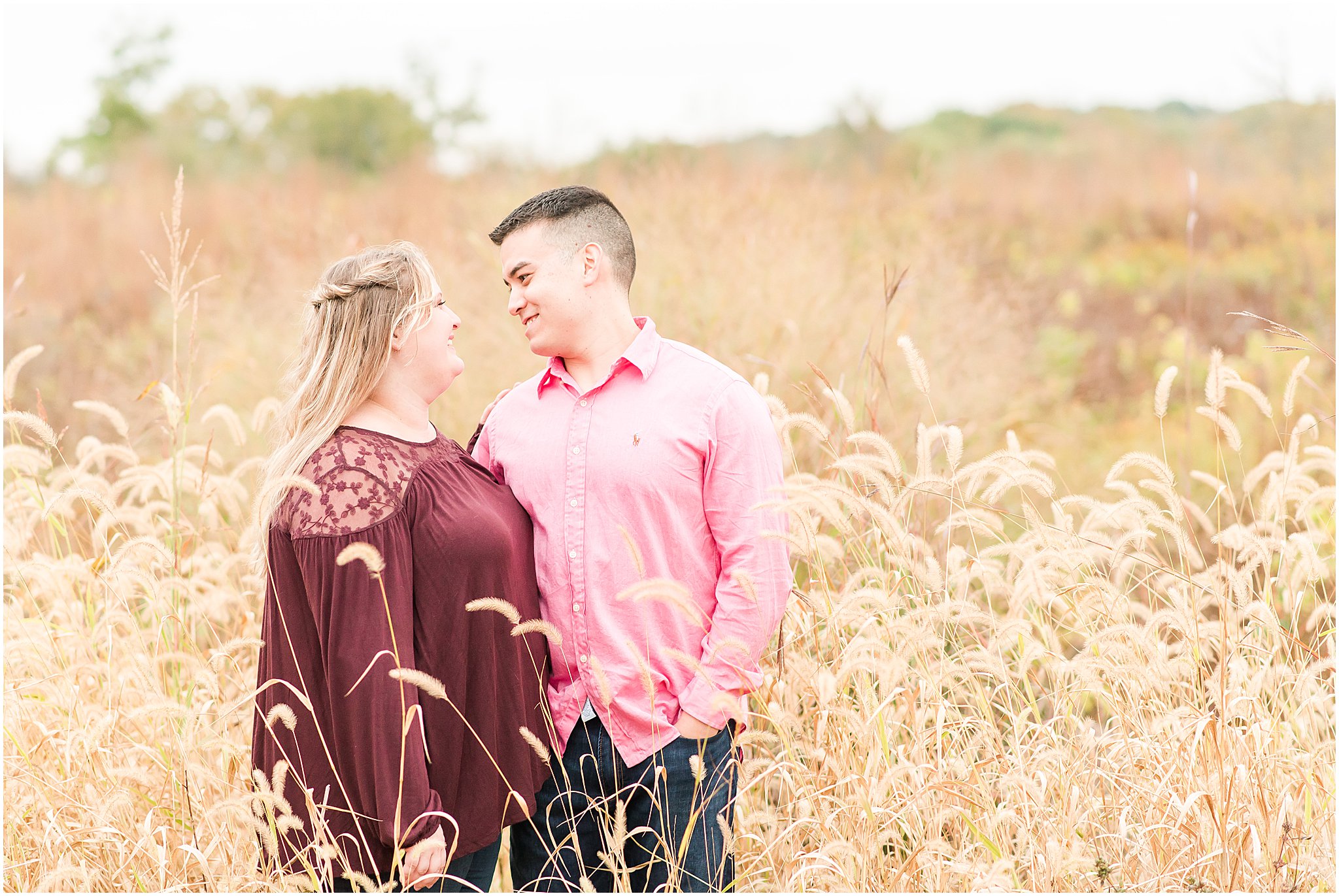 Couple smiling at each other during Beckley Creek Park engagement session