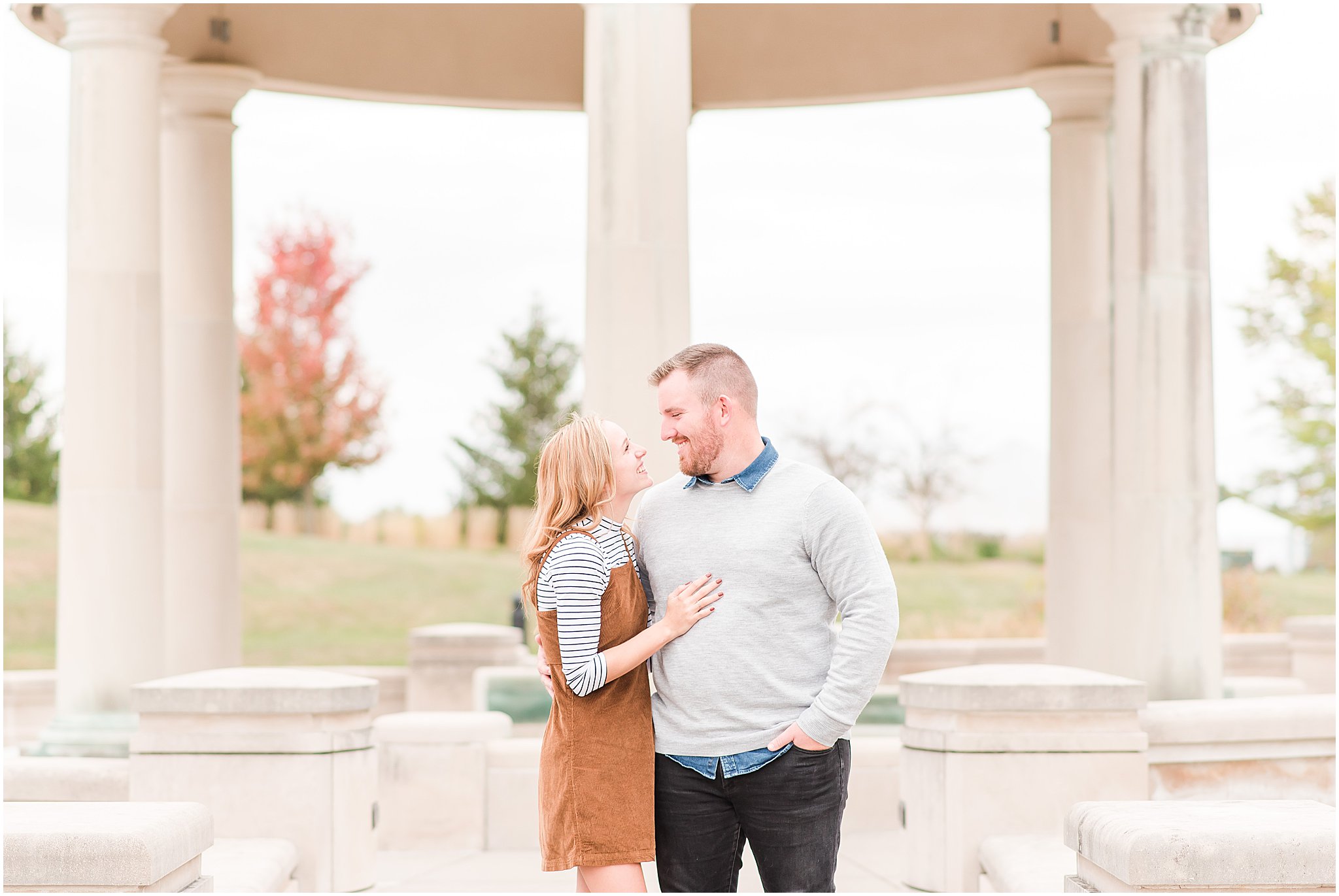 Couple smiling at each other during Coxhall Gardens engagement session