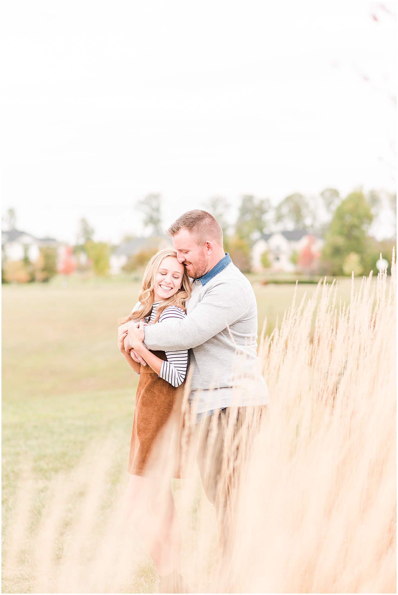 Couple nuzzling during Coxhall Gardens engagement session