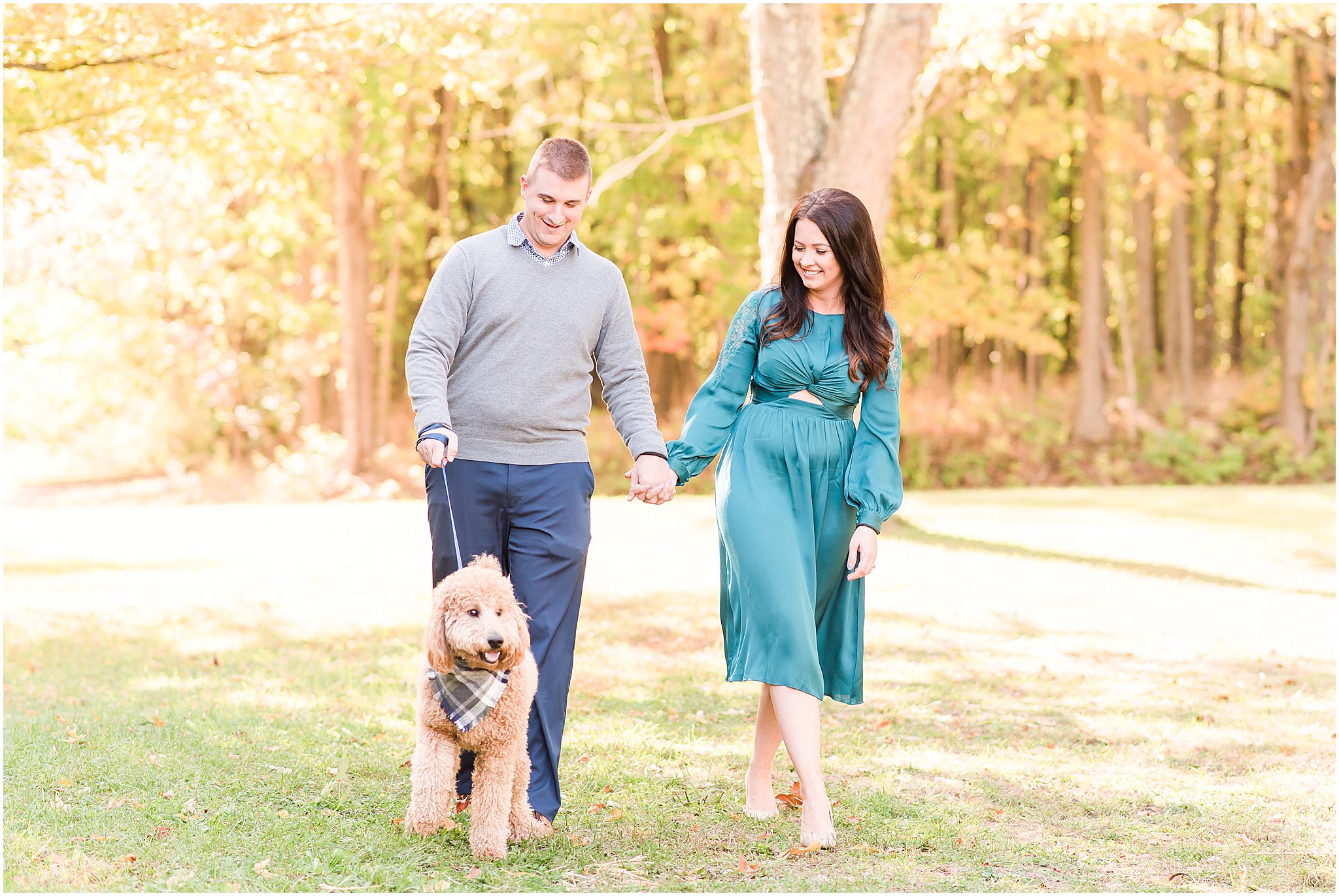 Couple walking with Goldendoodle during Eagle Creek Park couples session