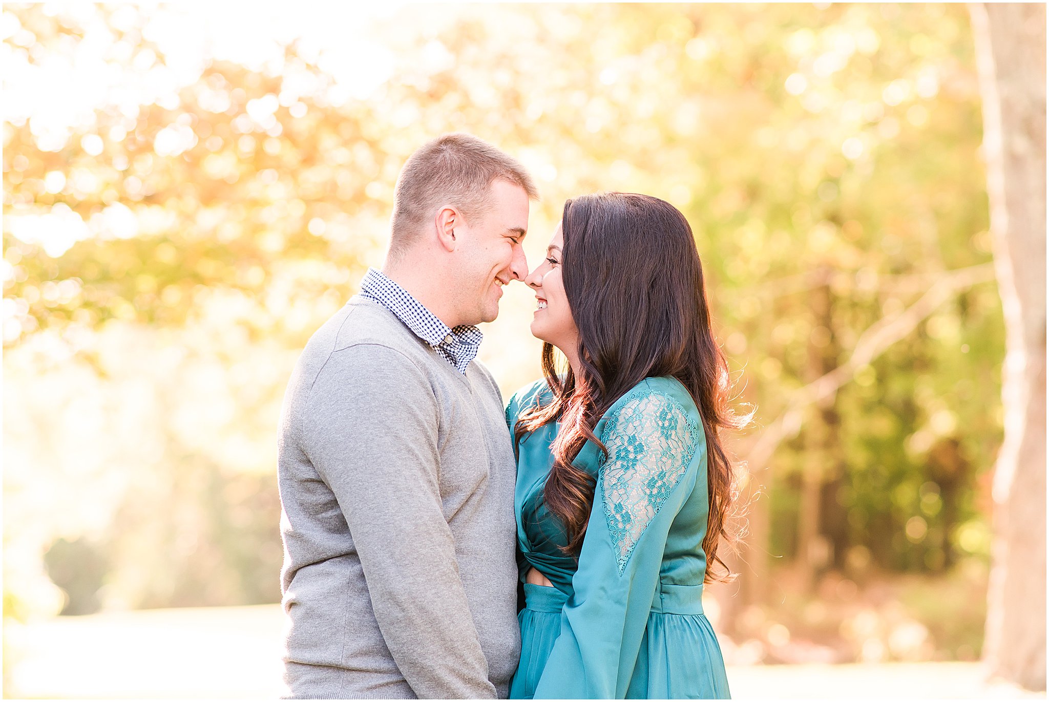 Couple laughing nose to nose during Eagle Creek Park couples session