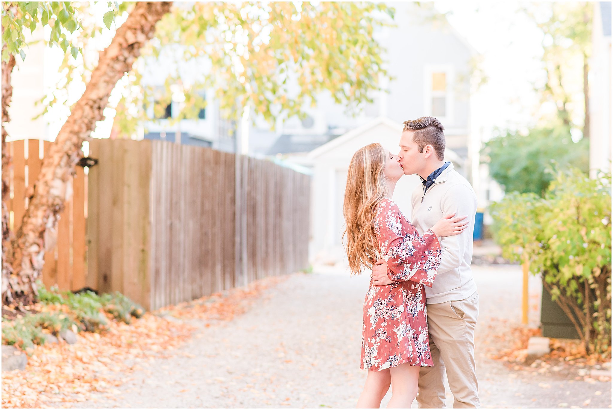 Couple chest to chest kissing during Lockerbie Square engagement session