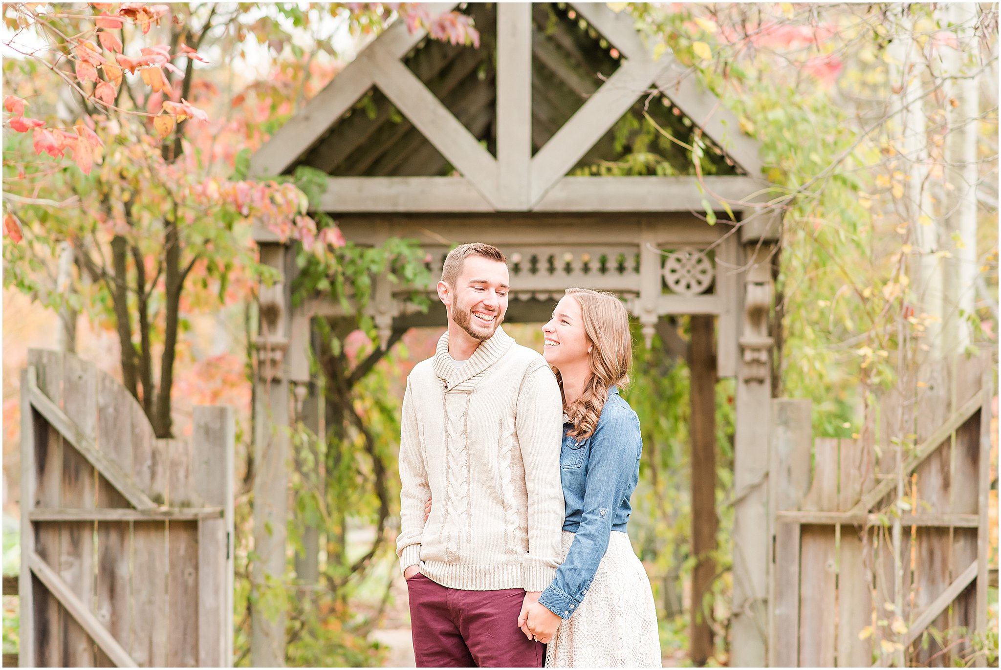 Couple laughing at each other during Defries Gardens engagement session