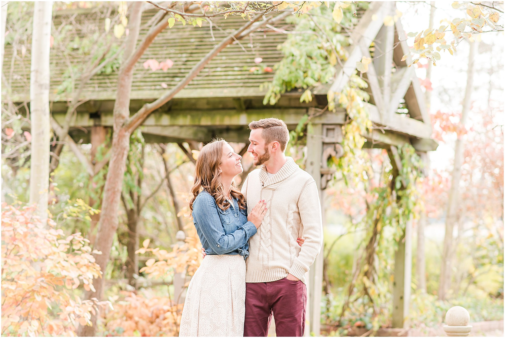 Couple smiling at each other during Defries Gardens engagement session