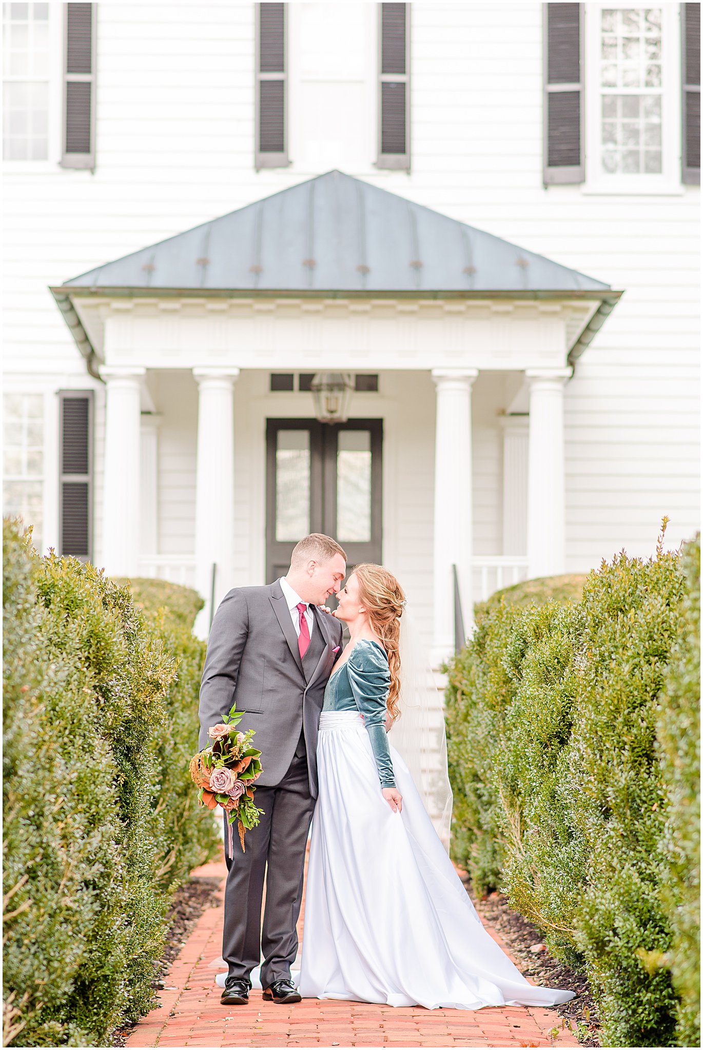 Bride and groom nose to nose in front of Mount Ida mansion Mount Ida Farm wedding
