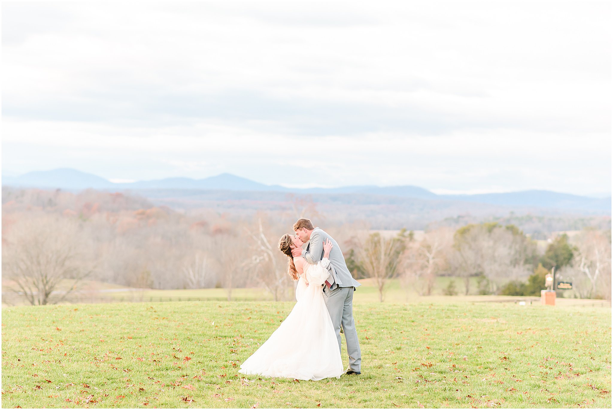 Bride and groom kissing mountain background Mount Ida Farm Wedding