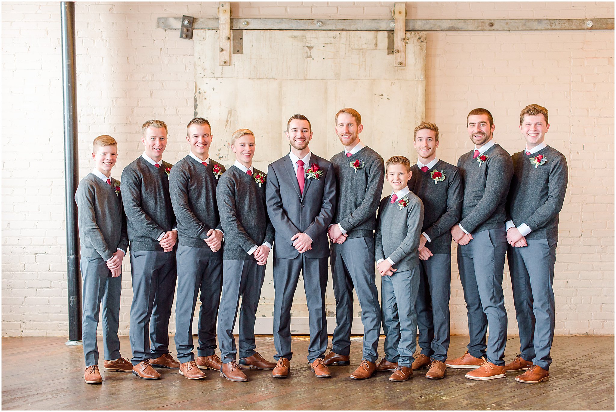 Groom and groomsmen smiling at camera Coppes Commons Wedding