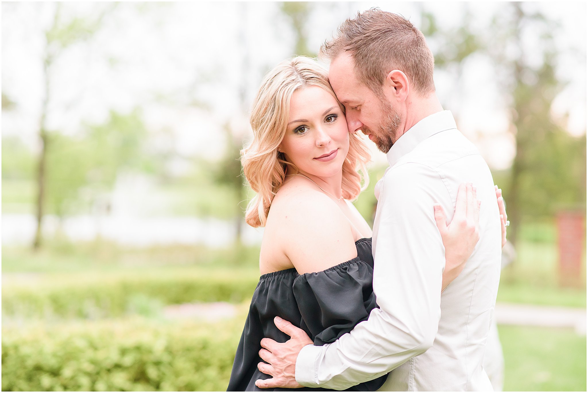 Couple nuzzling during Coxhall Gardens engagement session