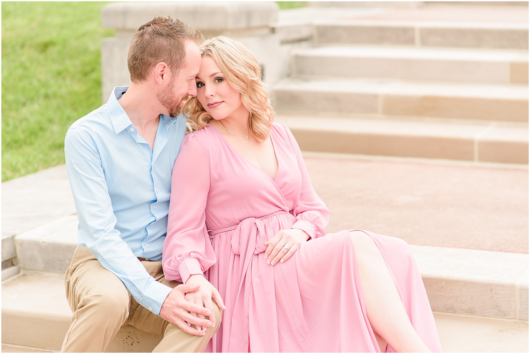 Couple sitting and snuggling during Coxhall Gardens engagement session