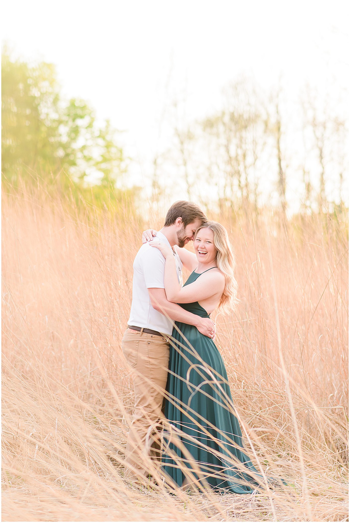 Couple nuzzling and laughing during Eagle Creek Park Engagement Session