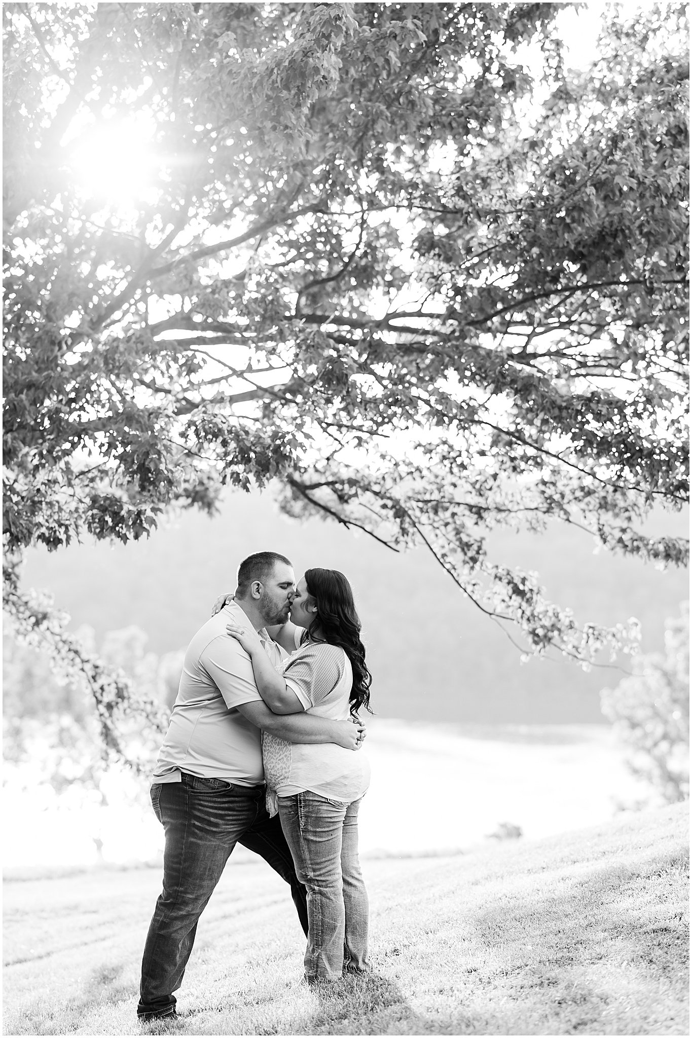 Couple kissing during Brookville Lake engagement session