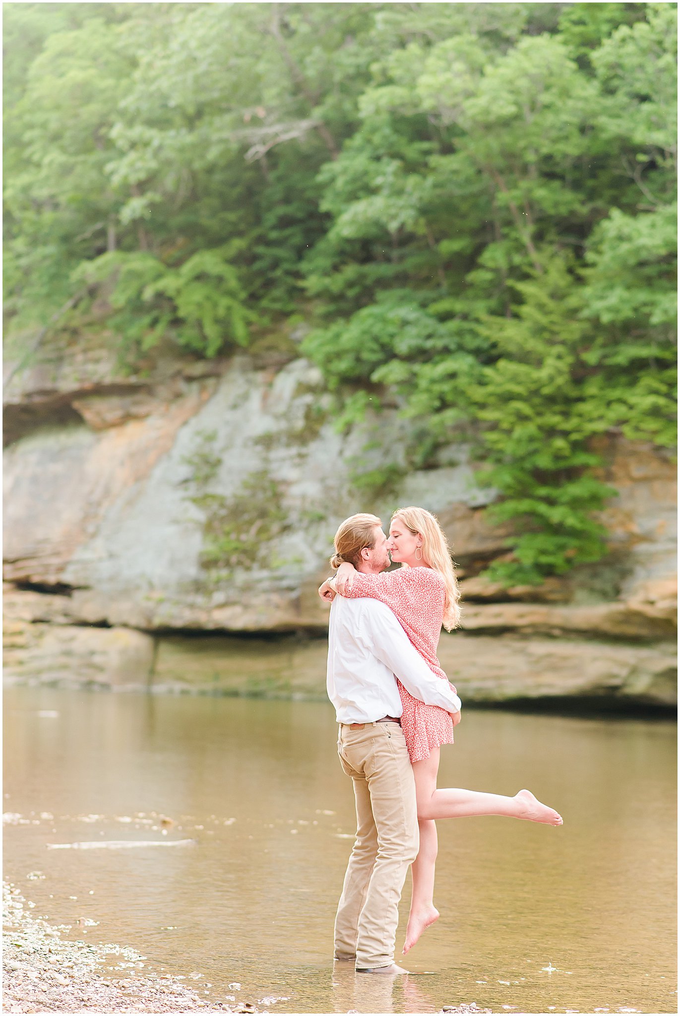 Lift kiss in the water during Turkey Run State Park engagement session