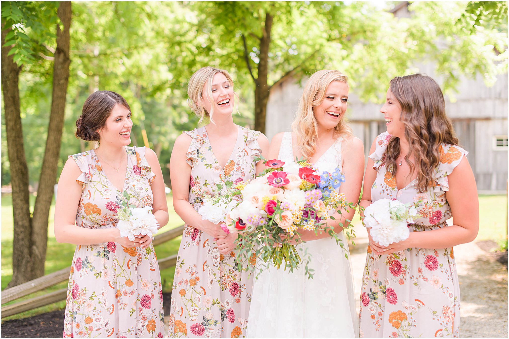 Bride and bridesmaids laughing together The Old Barn At Brown County wedding