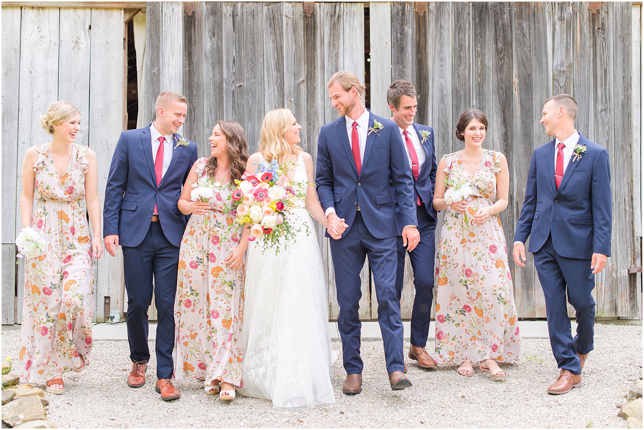 Bridal party walking and laughing The Old Barn At Brown County wedding