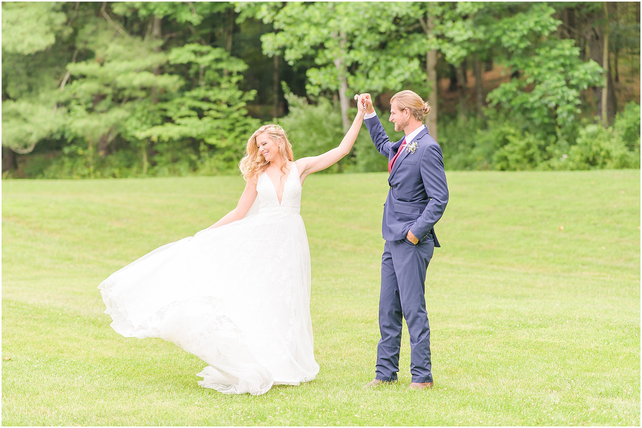 Bride twirling dress while groom smiles at her The Old Barn At Brown County wedding
