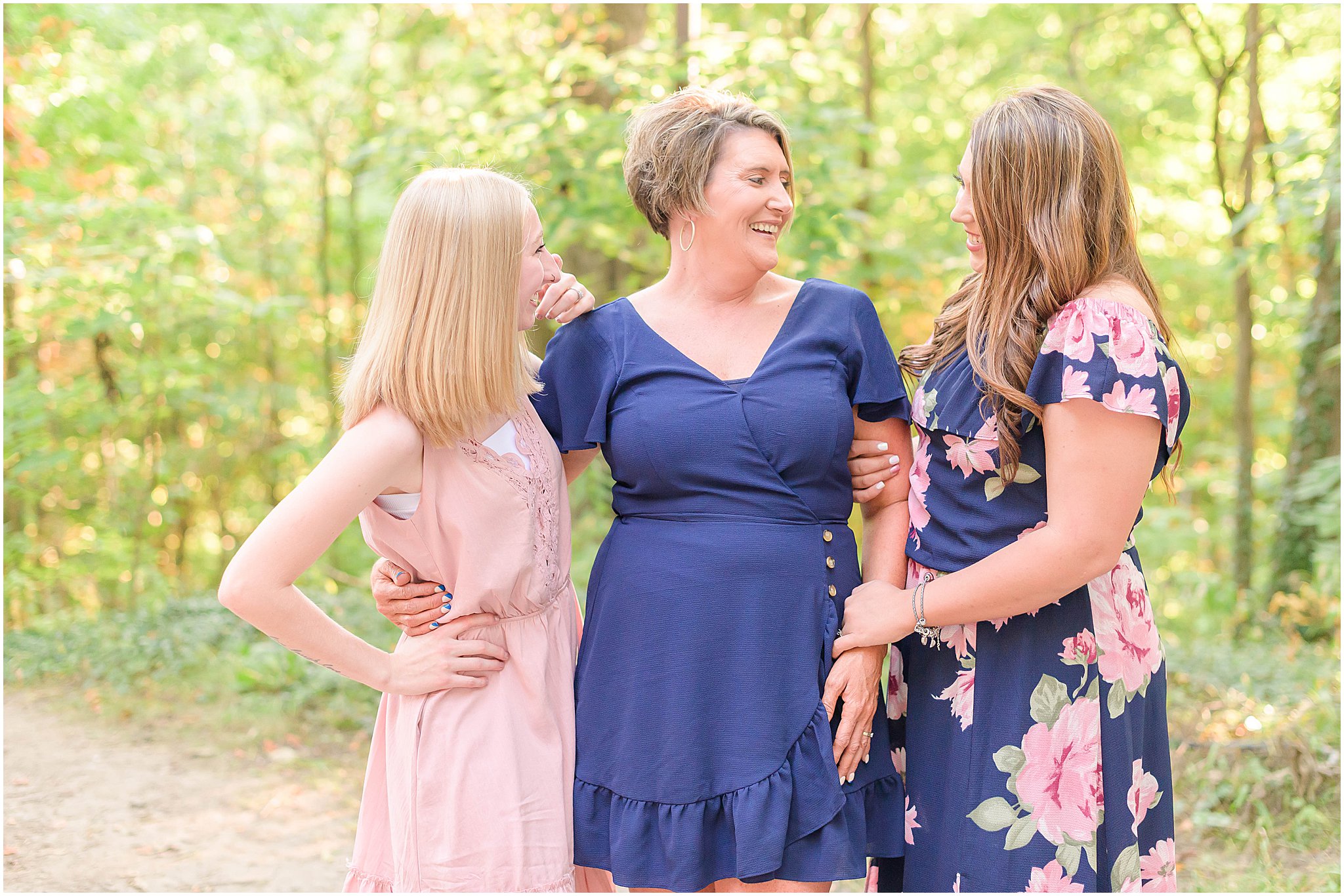 Mom laughing with daughters Holcomb Gardens family session