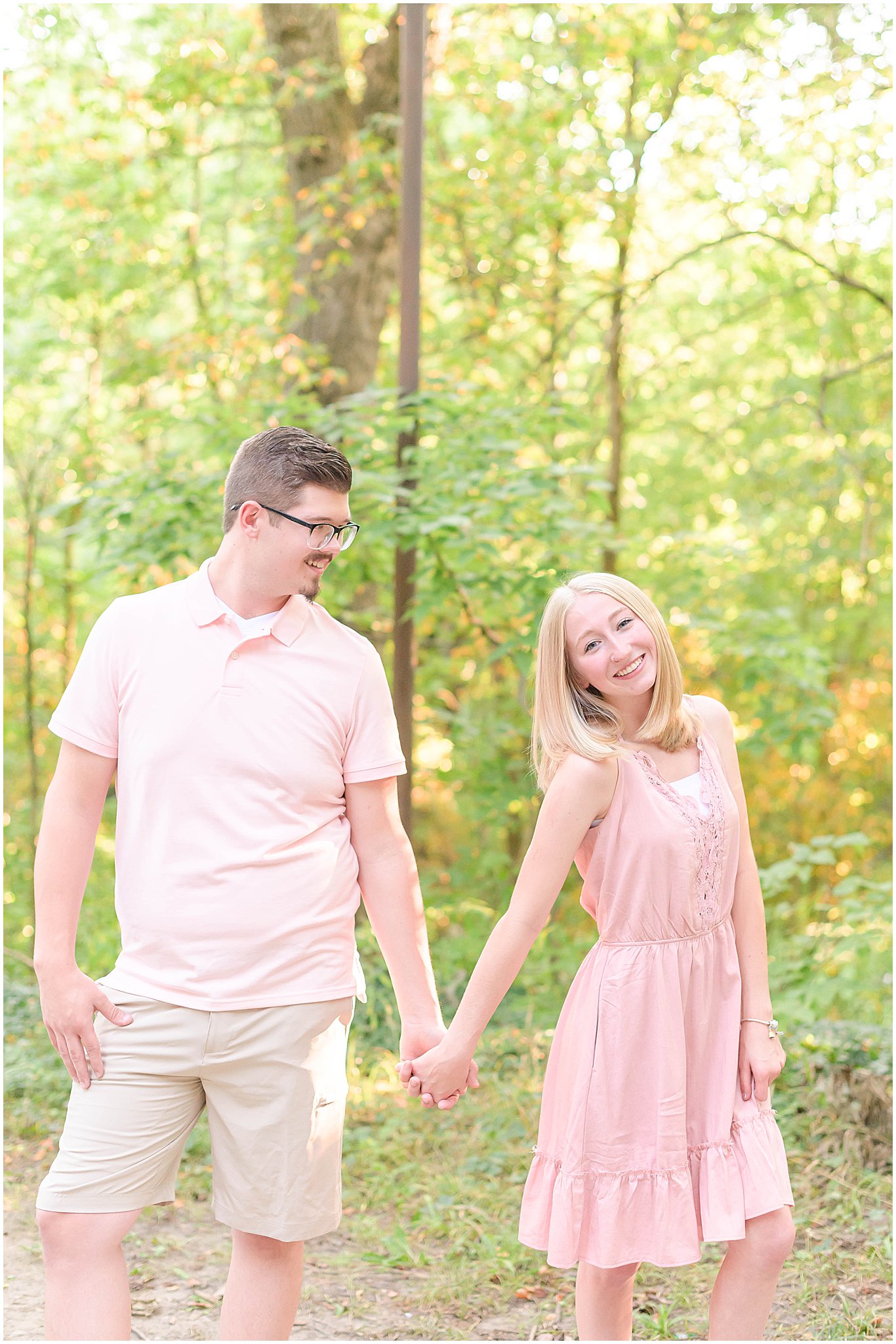 Couple holding hands and smiling Holcomb Gardens family session