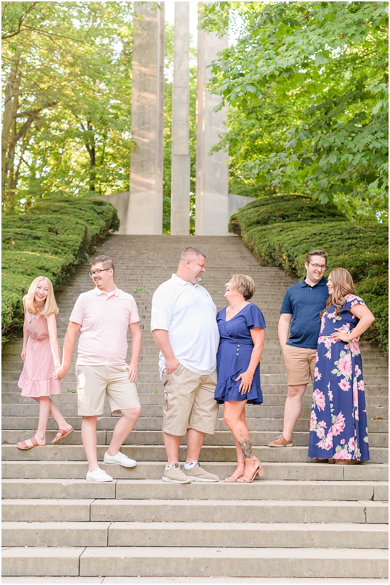 Family staggered in groups and laughing together Holcomb Gardens family session