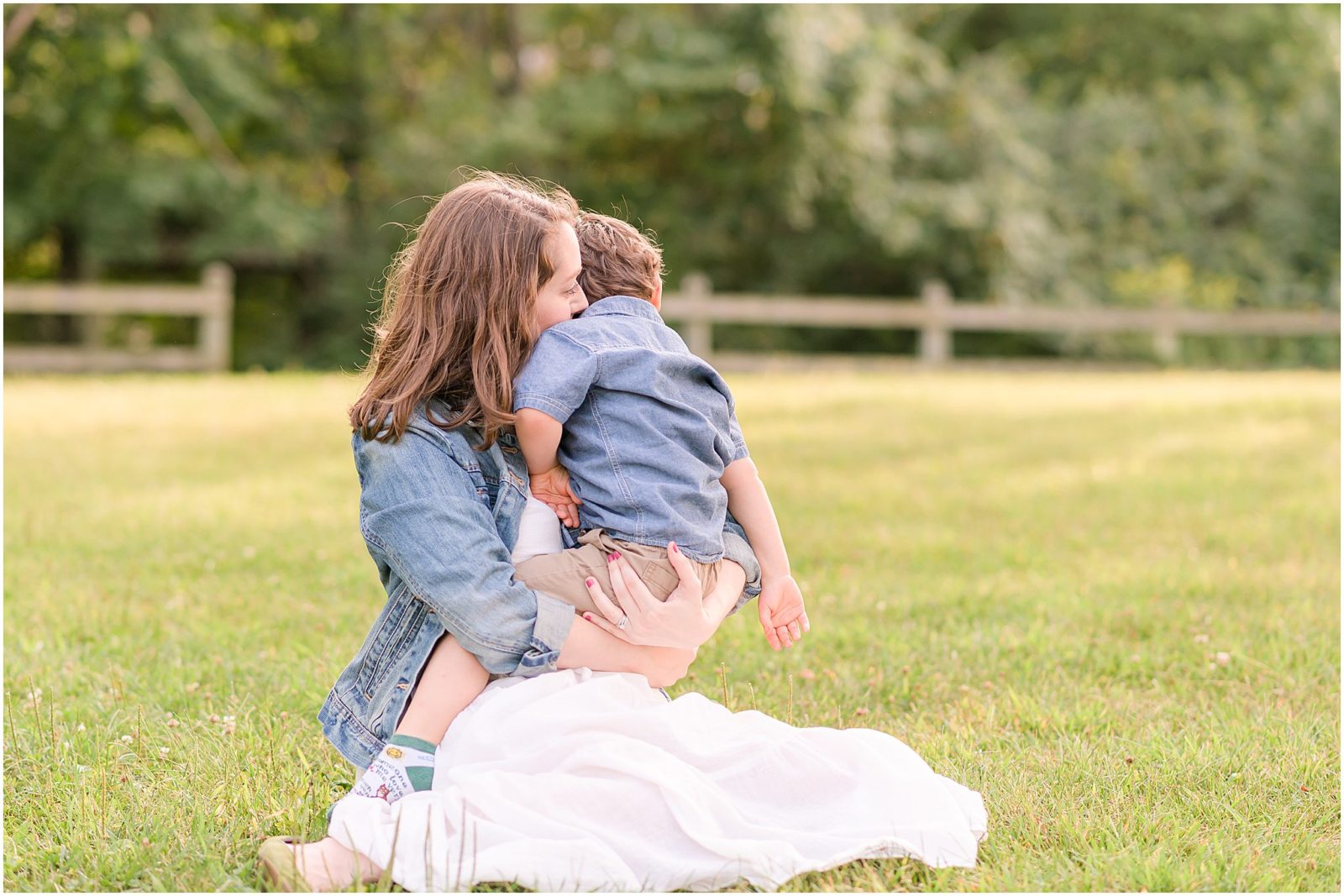 Mother cuddling son Cool Creek Park family session