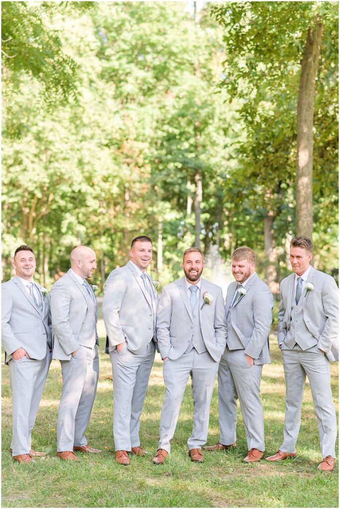 Groom and groomsmen laughing Lizton Lodge wedding