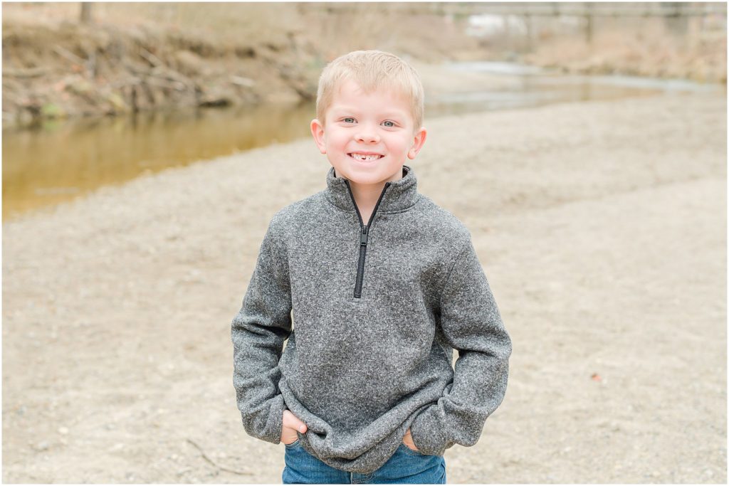 Young boy smiling at camera Ellis Park family session