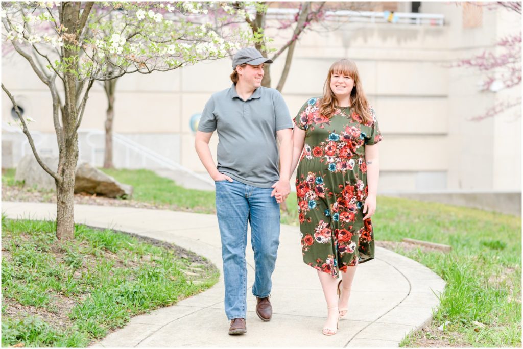 Couple holding hands and walking Downtown Indianapolis Canal Engagement Session