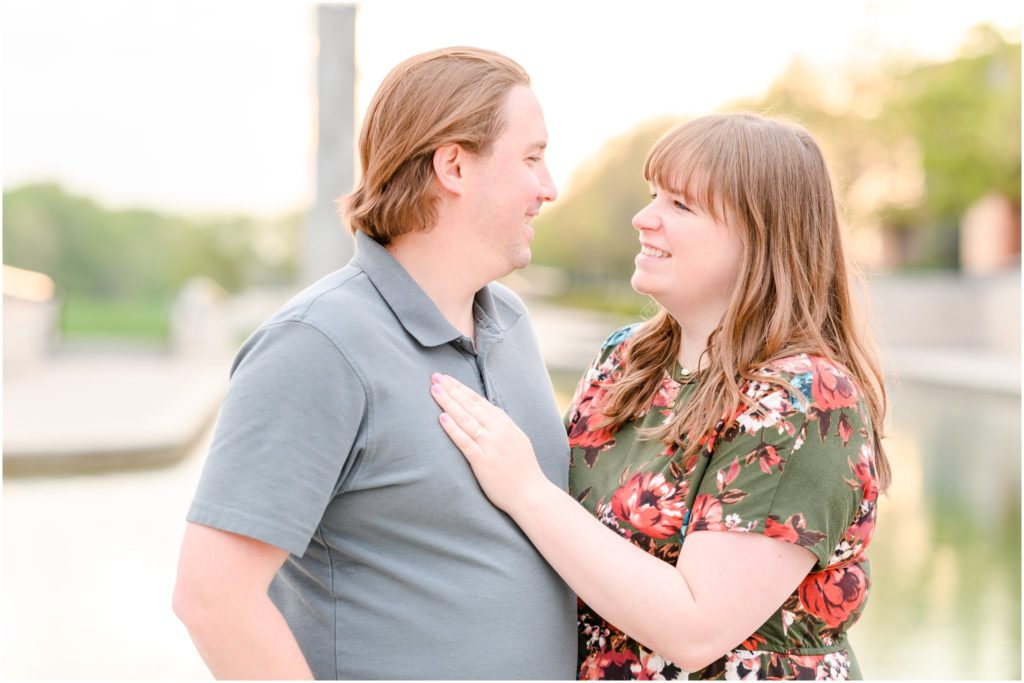 Couple smiling at each other Downtown Indianapolis Canal Engagement Session