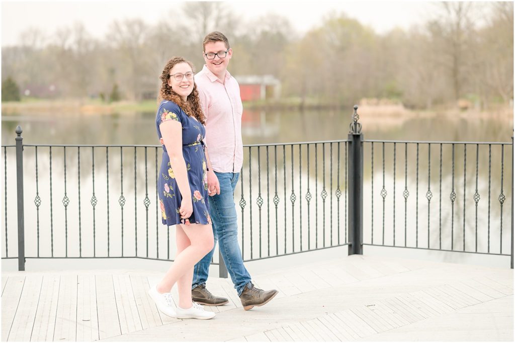 Couple holding hands and walking Fowler Park engagement session