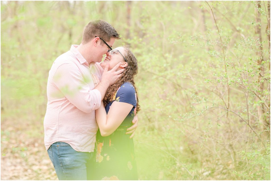 Couple smiling as almost kissing Fowler Park engagement session