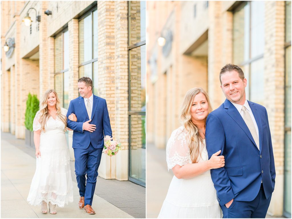Bride and groom walking together and smiling Ironworks Hotel Elopement