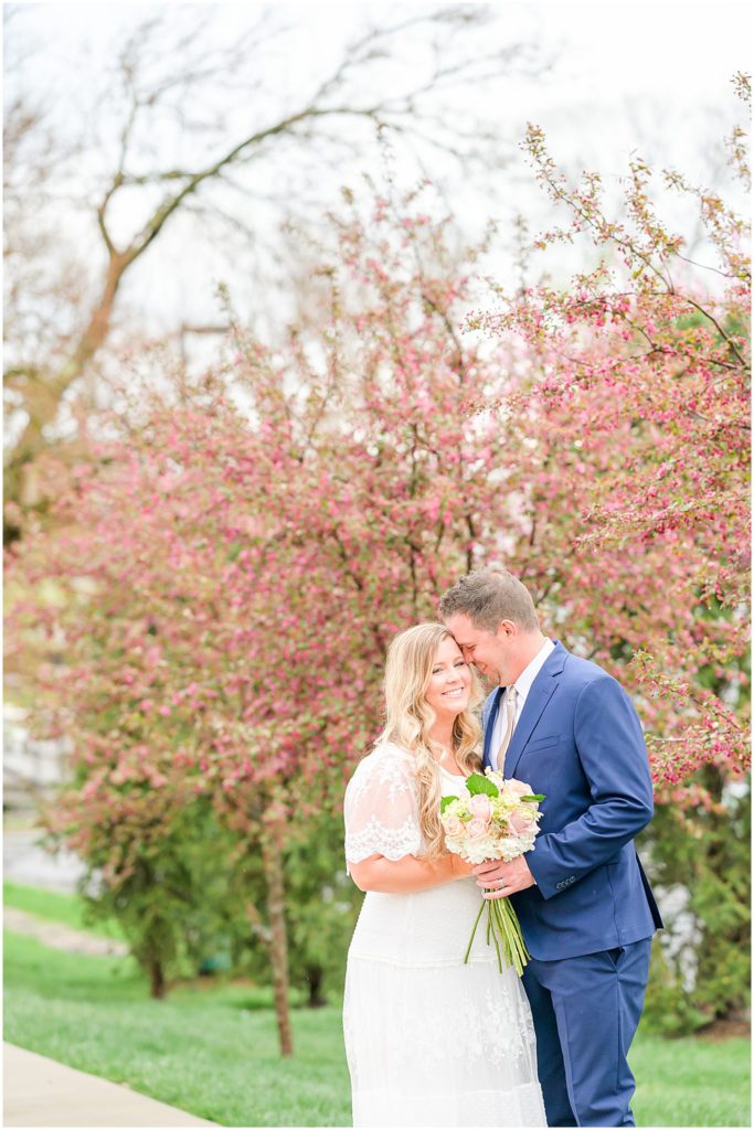 Bride and groom nuzzling and laughing Ironworks Hotel Elopement