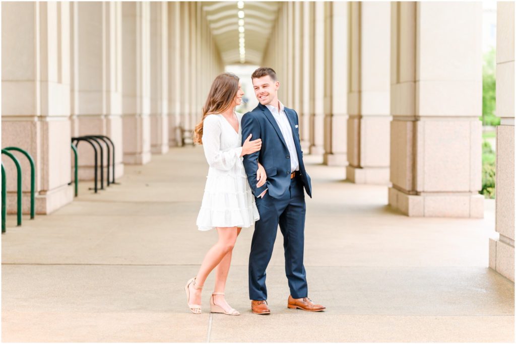 Couple laughing with each other downtown Indianapolis canal engagement session