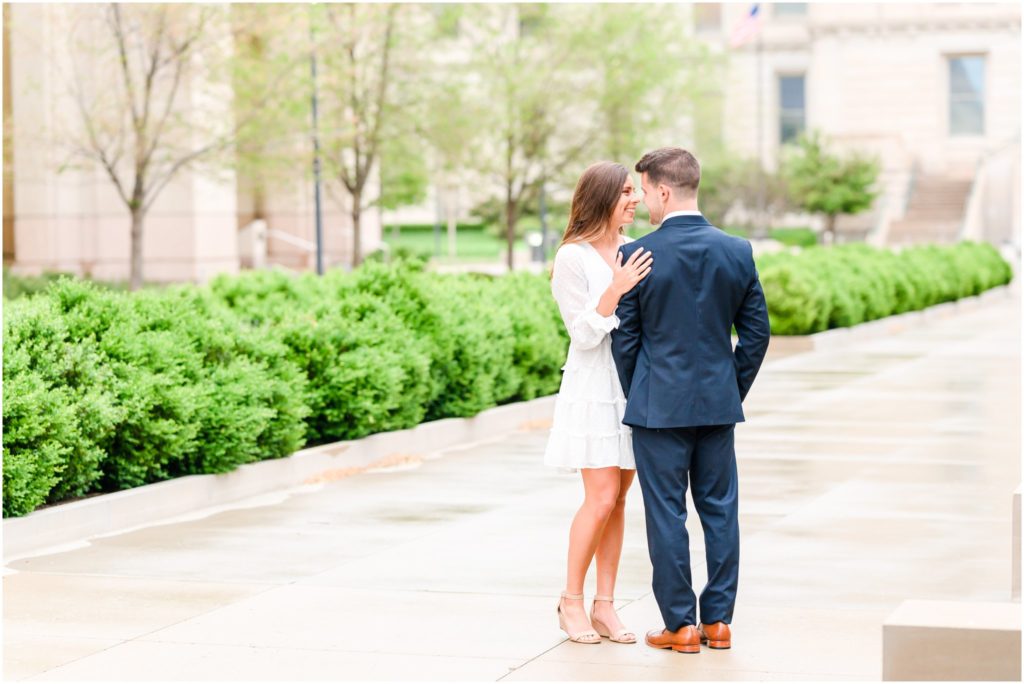 Couple smiling nose to nose downtown Indianapolis canal engagement session