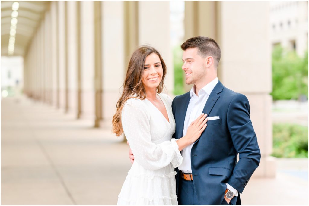 Bride smiling at camera downtown Indianapolis canal engagement session