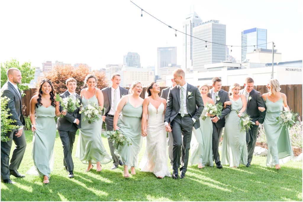 Bridal party walking and laughing together Mavris Arts & Event Center Wedding