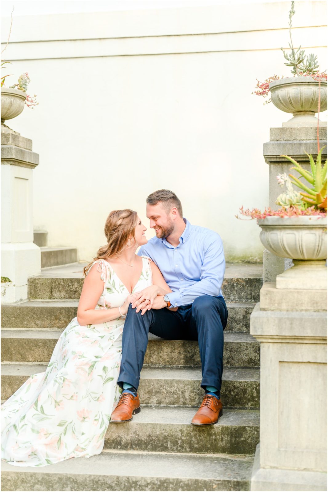 Couple sitting and cuddling Newfields engagement session