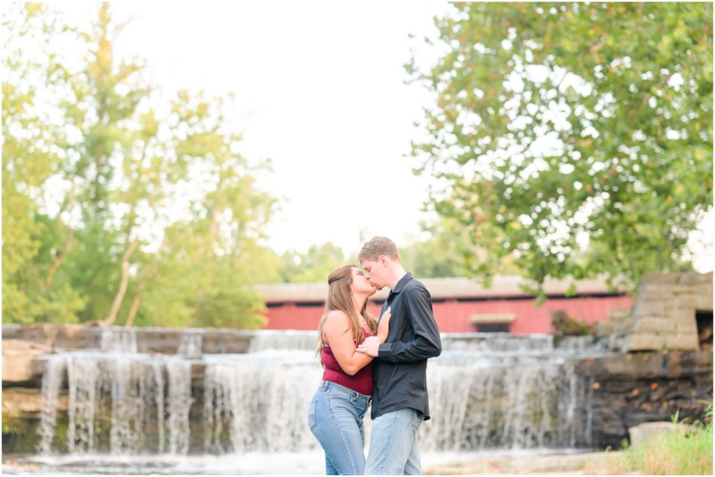 Dip kiss in water Cataract Falls engagement session