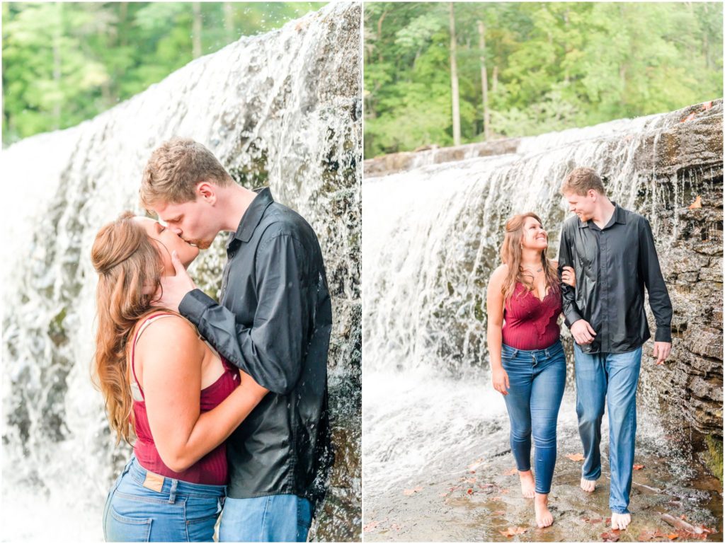 Couple walking through waterfall Cataract Falls engagement session