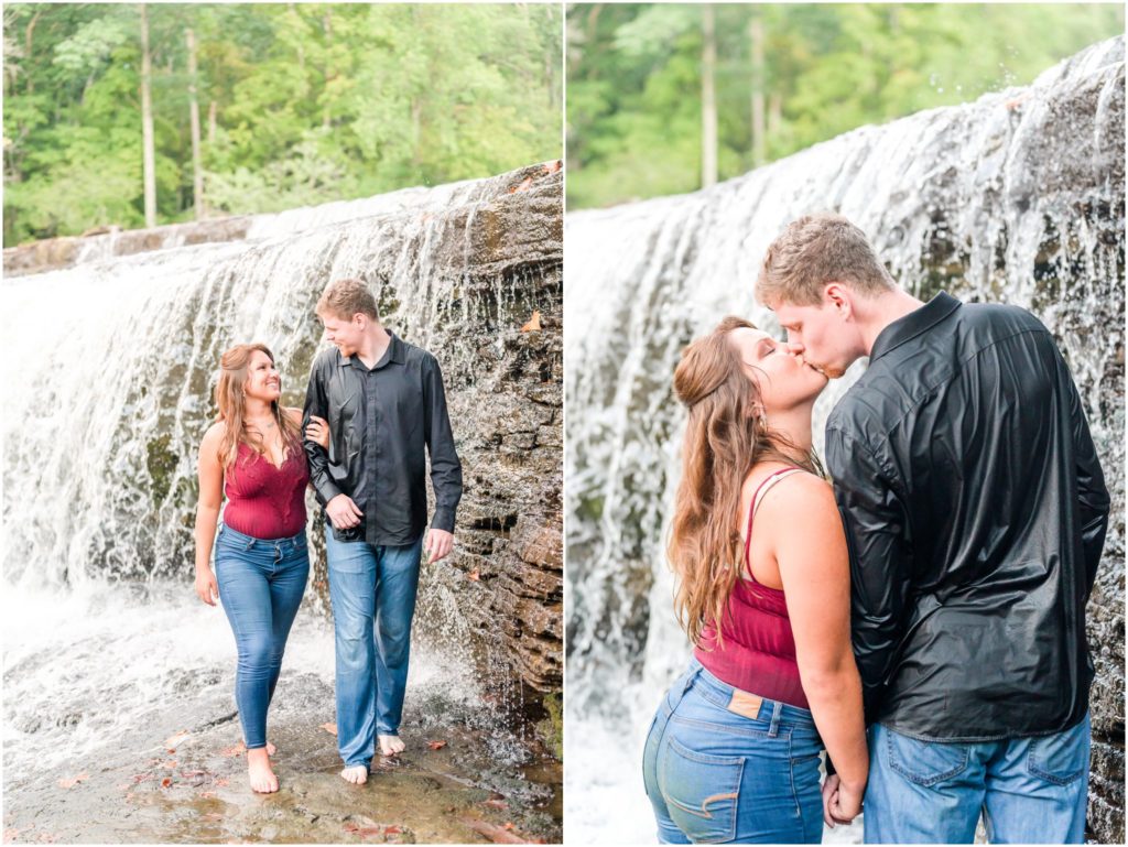 Couple walking under waterfall Cataract Falls engagement session
