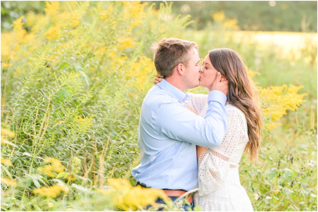 Couple kissing in field New Castle Indiana engagement session