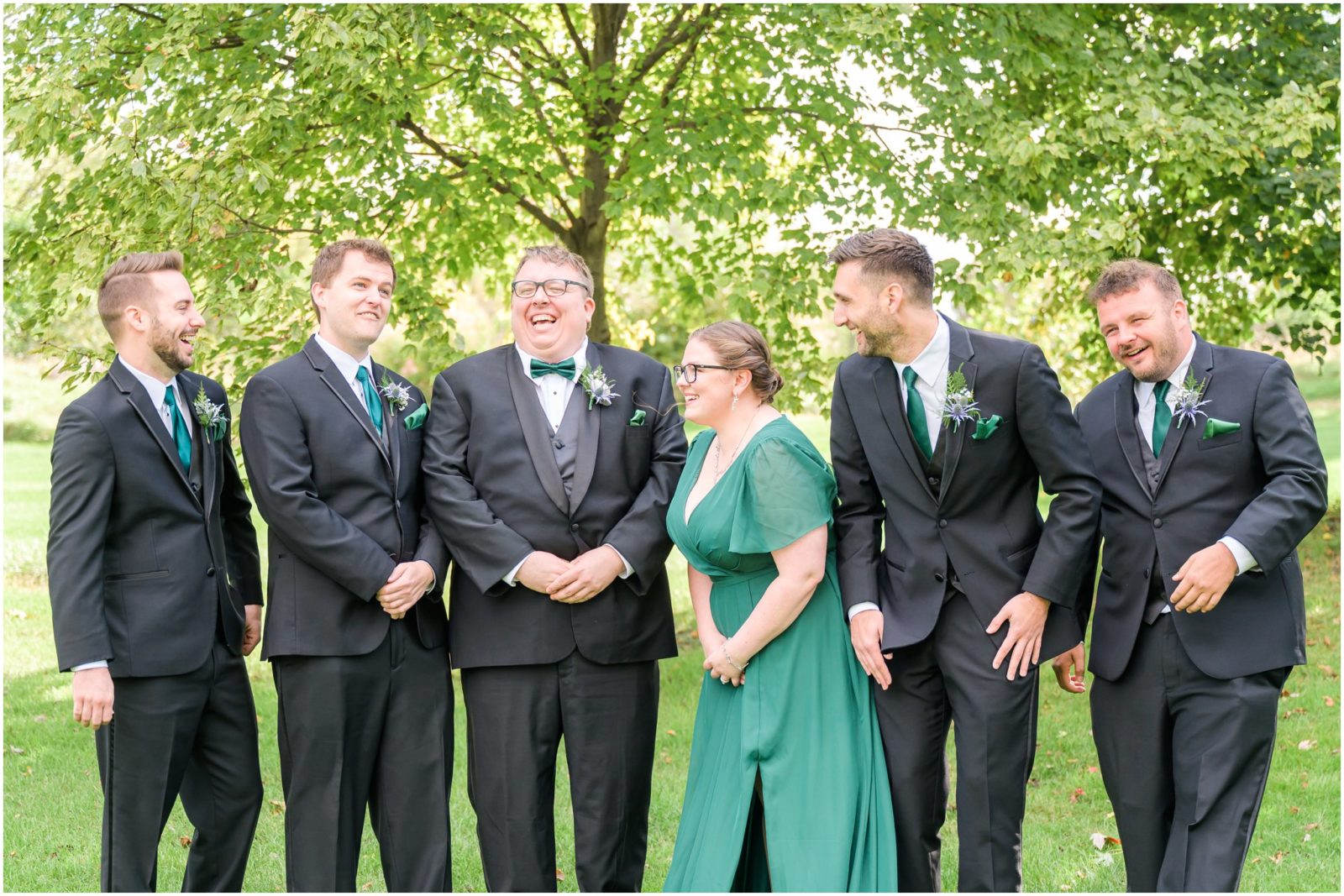 Groom and groomsmen laughing together Balmoral House wedding