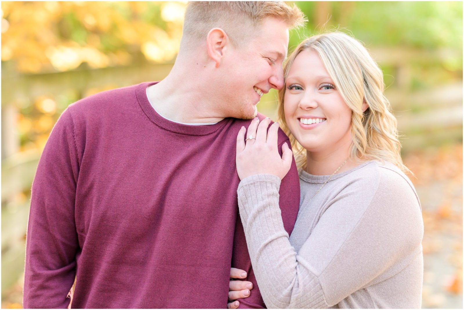 Couple nuzzling and laughing Eagle Creek Park engagement session