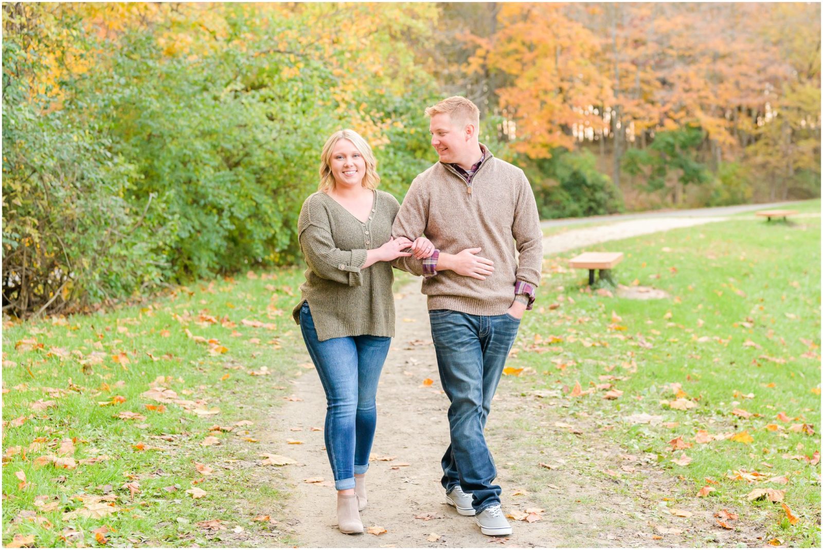 Couple walking and smiling together Eagle Creek Park engagement session